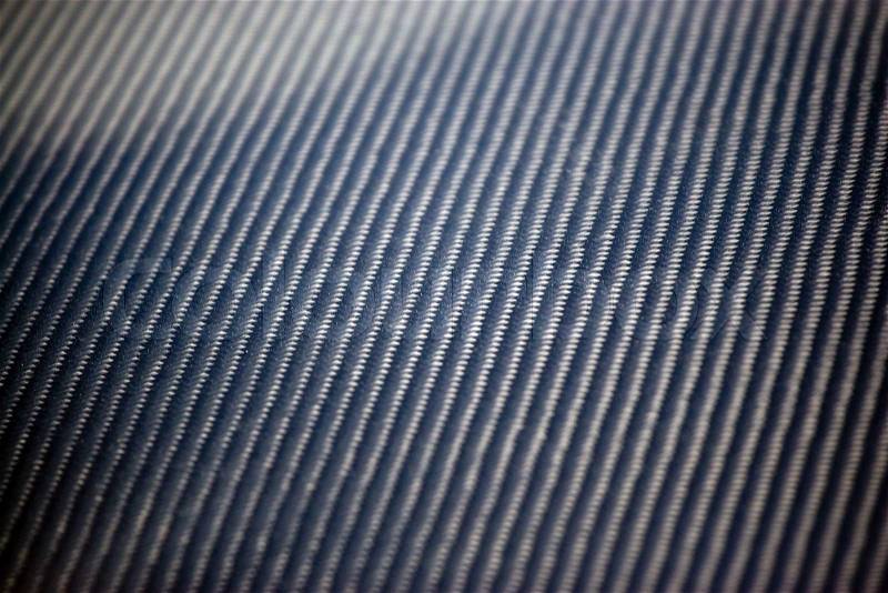 A closeup of real carbon fiber materialThis makes an excellent texture or backgroundShallow depth of field, stock photo
