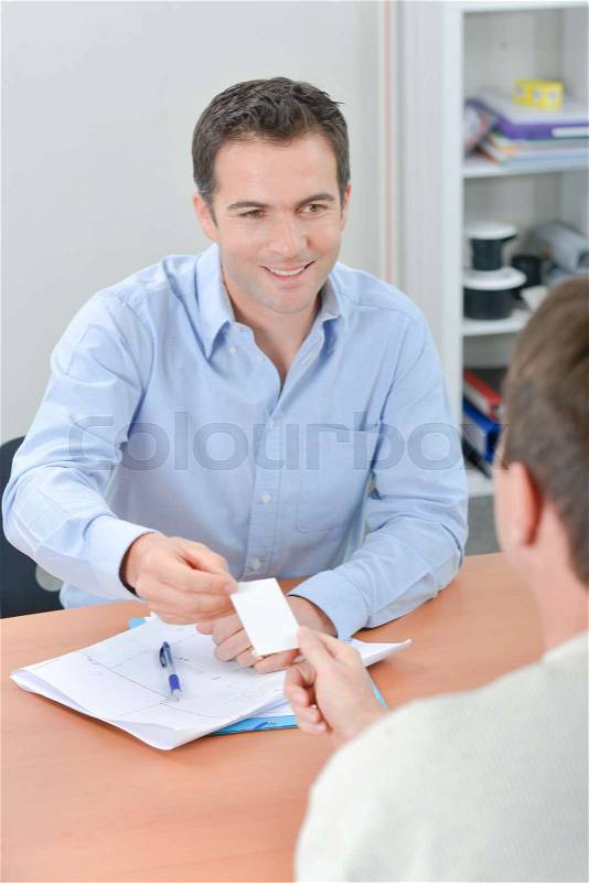 Here\'s my business card, stock photo