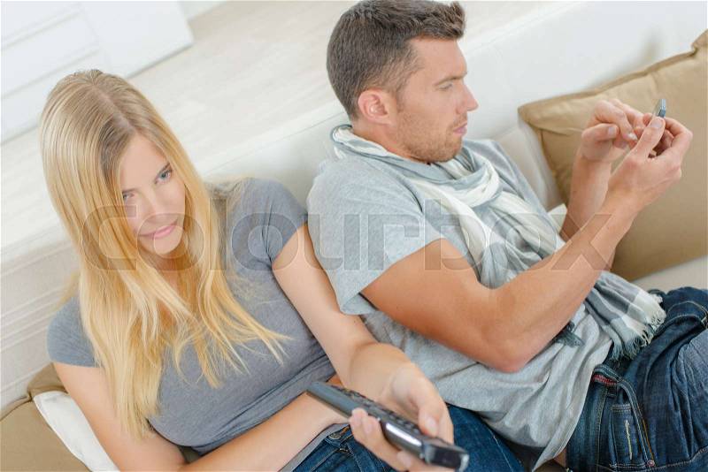 Couple in the living room, stock photo