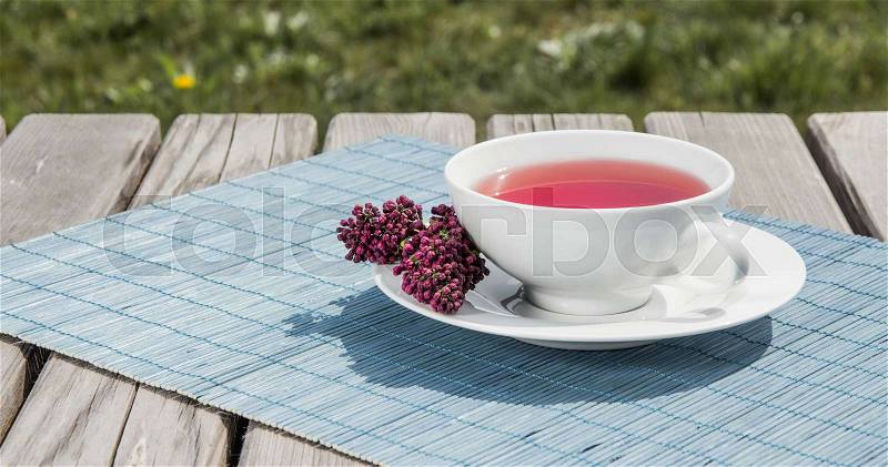 Tea of pomegranate. Hot red healthy drink. Outdoors, stock photo