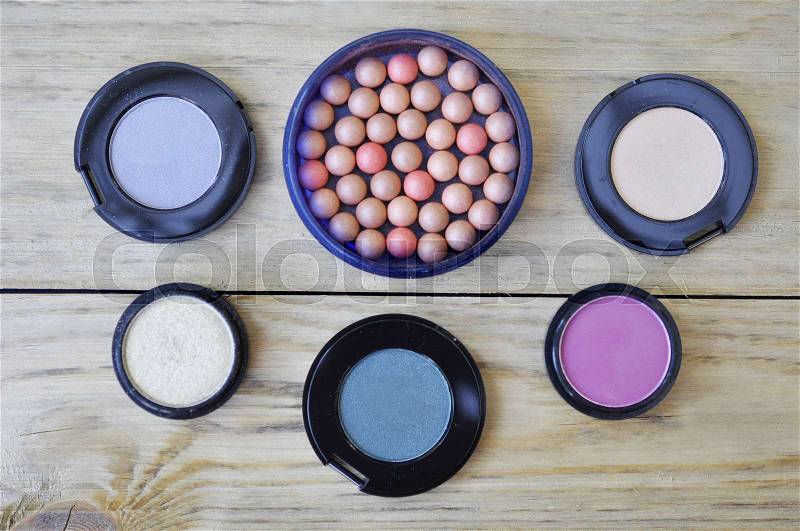 Many Eye Shadows And Rouge On Wood Table, stock photo