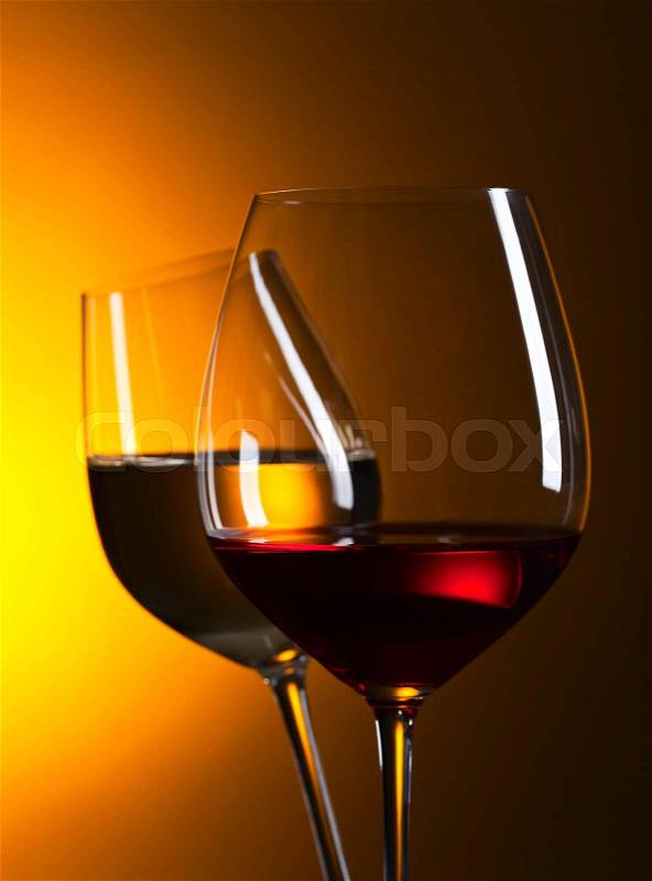 Closeup of glasses with red and white wine, stock photo