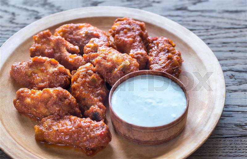 Fried chicken wings with blue cheese sauce, stock photo