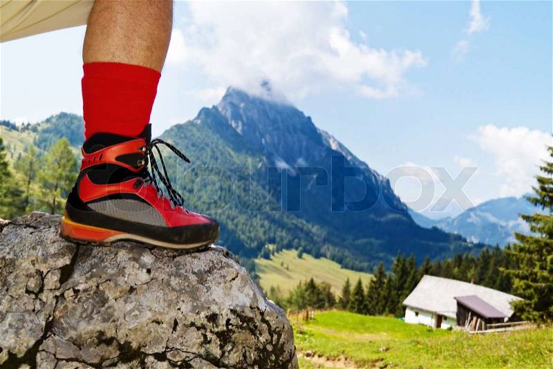 Red hiking boots on a hike in the mountains of Austria Activity during leisure time, stock photo