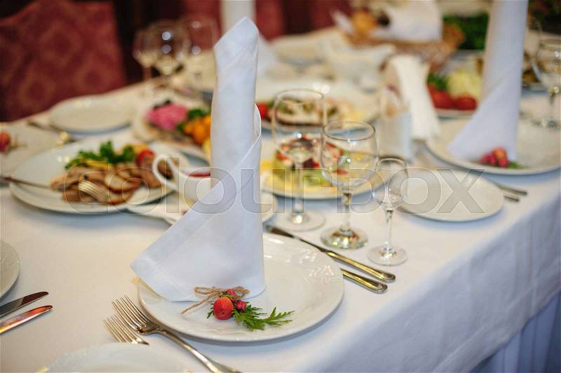 Beautiful table setting for a wedding dinner in the restaurant, stock photo