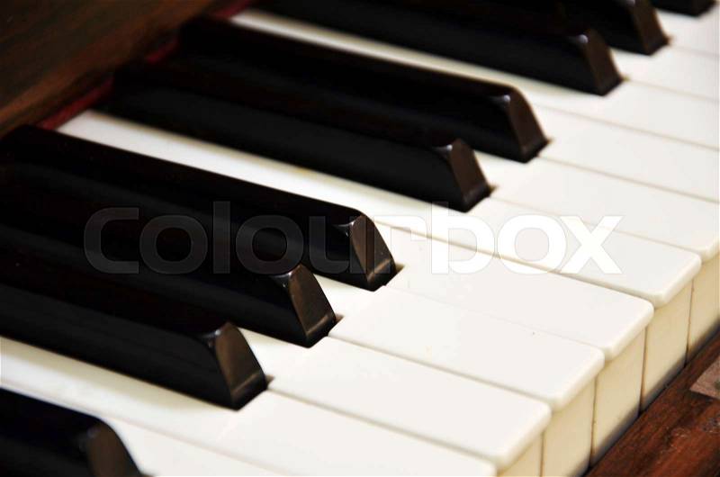 Old grunge piano keyboard. Top view of piano, stock photo