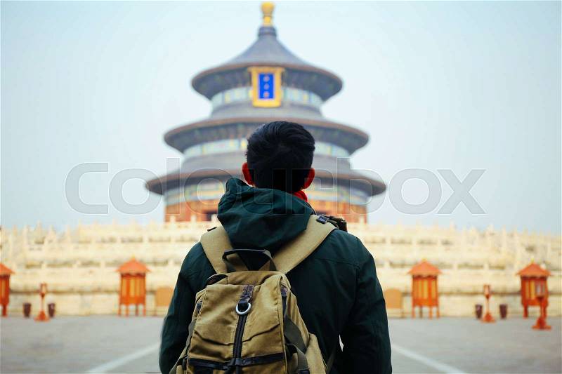 Young traveler standing in front of temple of heaven - in Beijing, China. Asia Travel, stock photo