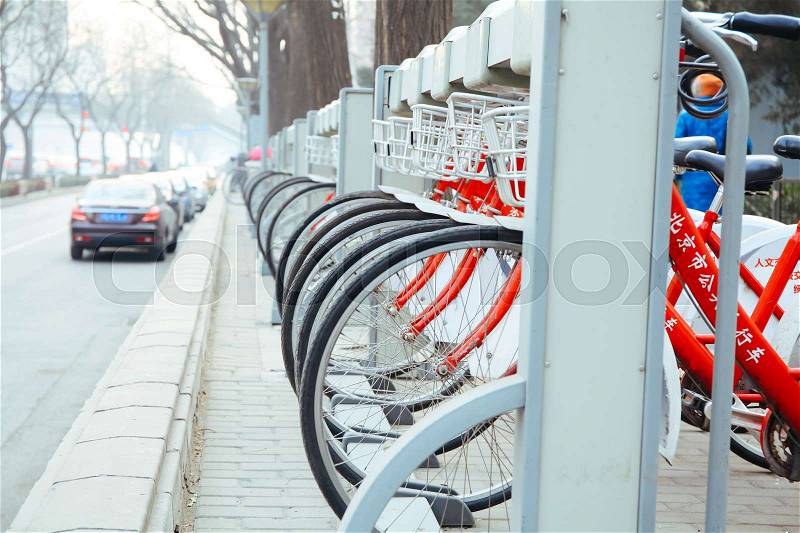 BEIJING,CHINA 6 JANUARY 2017: Public Bike Rental Station in Beijing, China with Bicycles arranging in row ready for public rental, stock photo