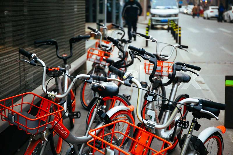 BEIJING,CHINA 6 JANUARY 2017: Mobike Bicycles in Beijing, China. Mobike is a popular bike sharing platform where users grab bikes through an app in many cities in China, stock photo