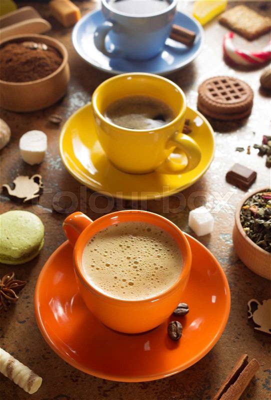 Cup of coffee, tea and cacao at table background, stock photo