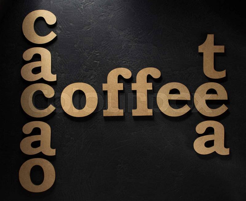 Coffee, cacao and tea letters on black background, stock photo