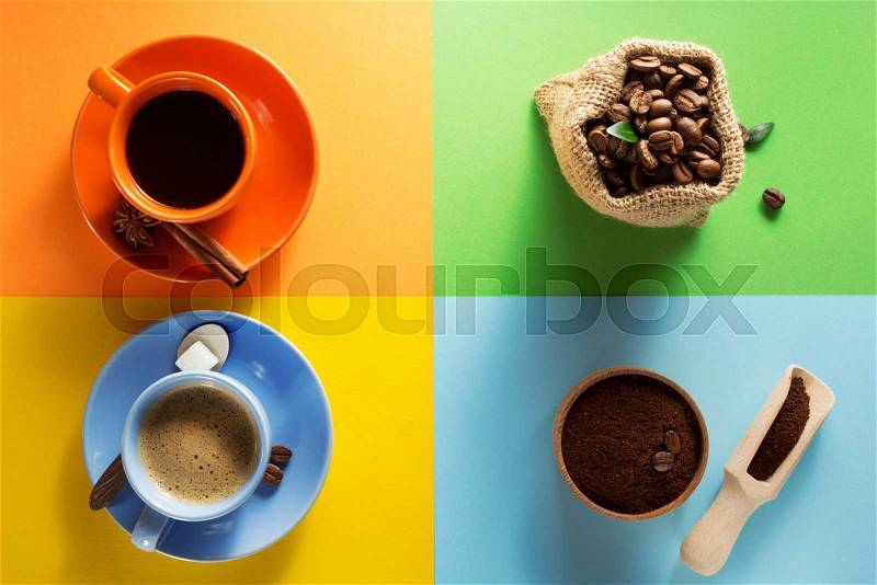 Cup of coffee and cacao at colorful paper background, stock photo