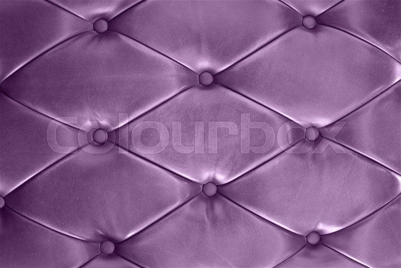 Classic purple leather texture of a couch with leather buttons, stock photo
