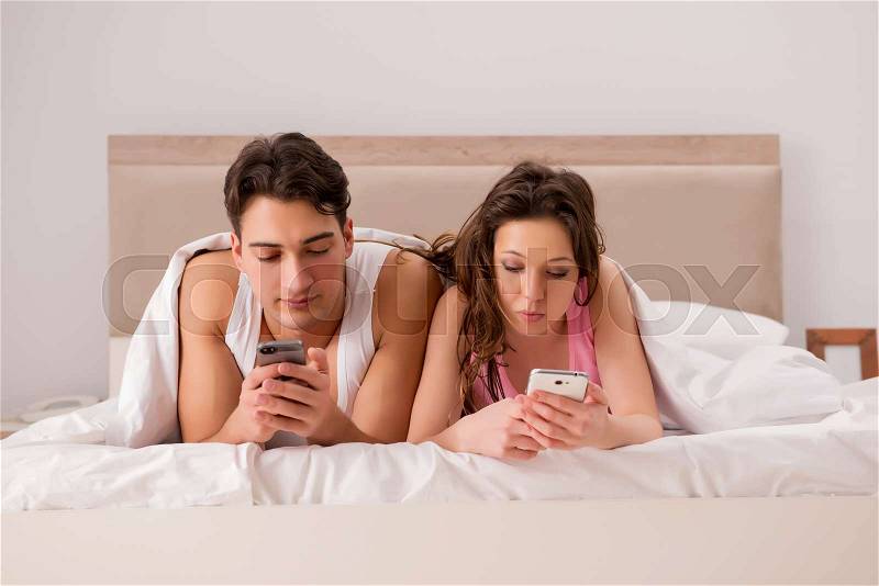 Family conflict with wife husband in bed, stock photo