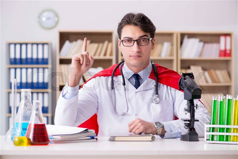 Superhero doctor working in the lab hospital, stock photo