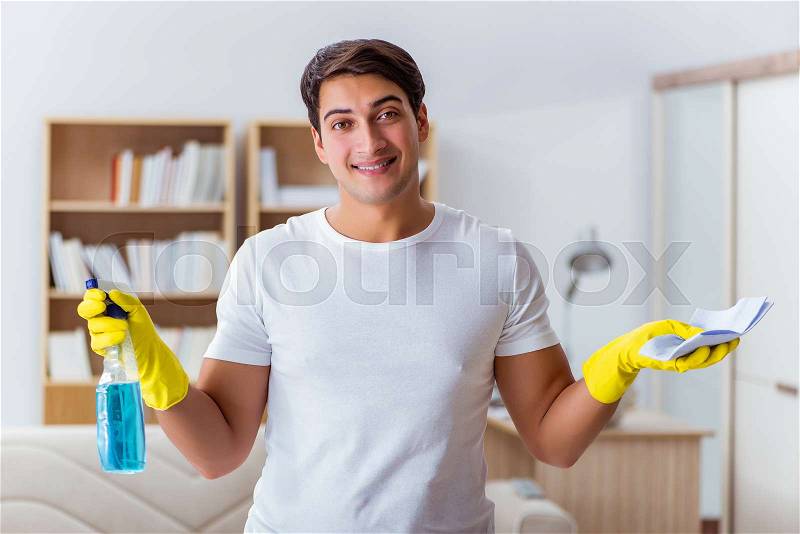 Man husband cleaning the house helping wife, stock photo
