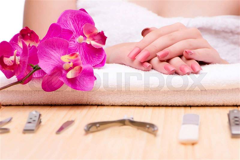 Woman hands during manicure session, stock photo