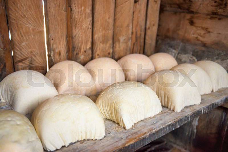 Rustic production of homemade farm cheese and dairy products, stock photo