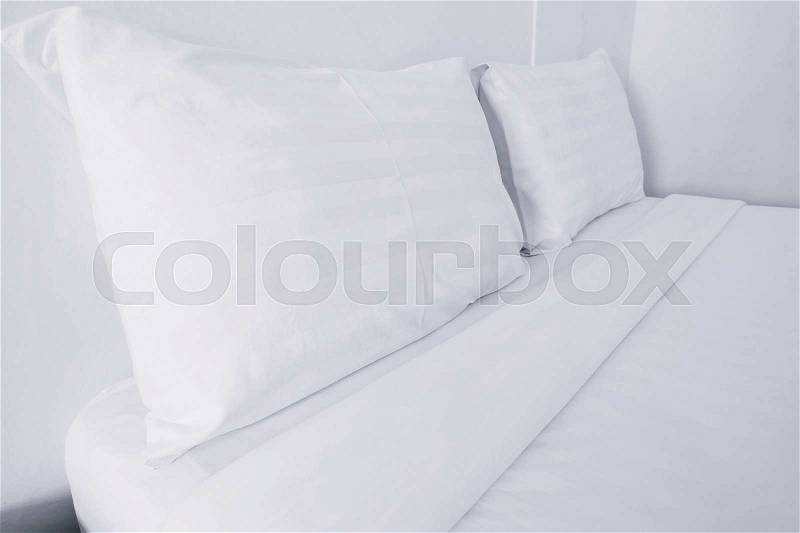 Close up white bedding sheets and pillow , stock photo