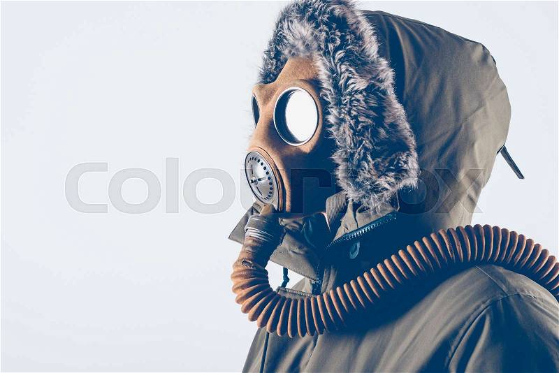 Man with old gas mask on white background , stock photo