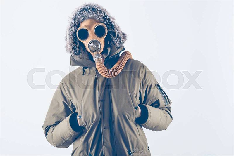 Scary man with vintage gas mask on white background, stock photo