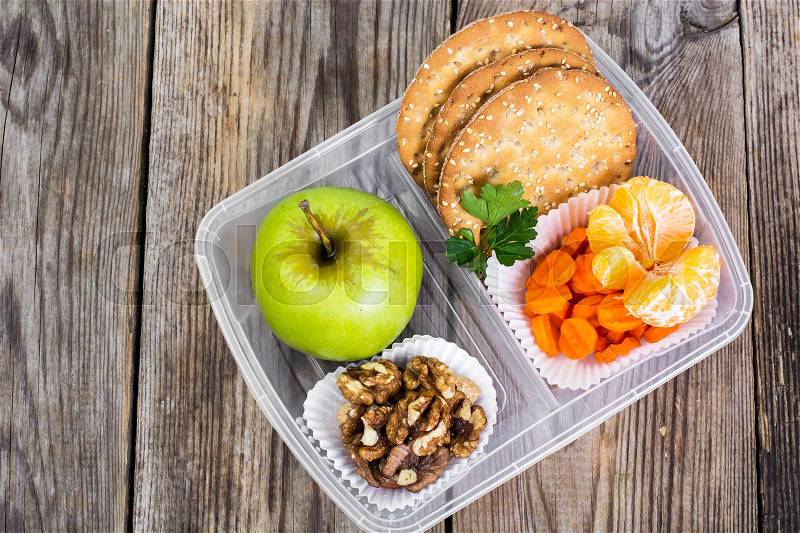 Health & Fitness food in lunch box on wooden background. Studio Photo, stock photo