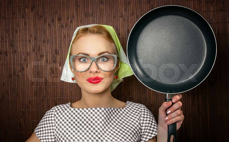 Close-up funny woman cook with pan - vintage concept, stock photo