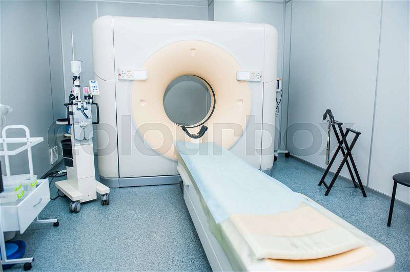 Computed tomography or computed axial tomography scan machine in hospital room, stock photo