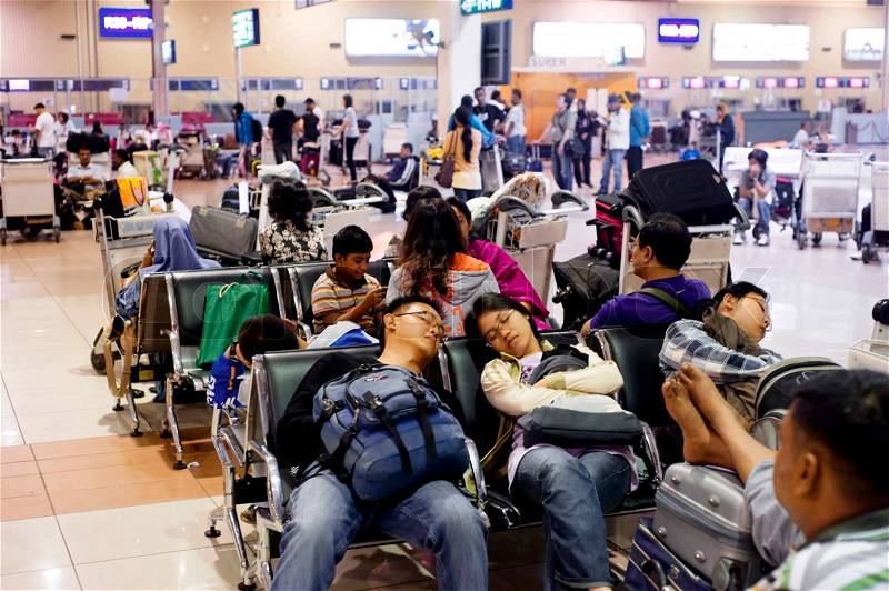 Kuala Lumpur, Malaysia - May05, 2011: People sleeping at airport as they waiting for a plane, stock photo