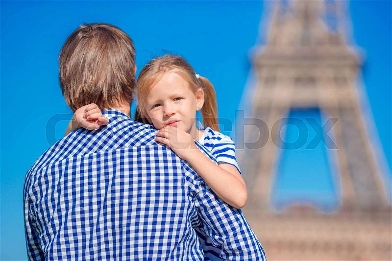 Happy family in Paris background Eiffel Tower. Dad and little girl on french vacation, stock photo