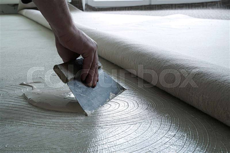 Floor Fitter When Applying Adhesive On Stock Image Colourbox