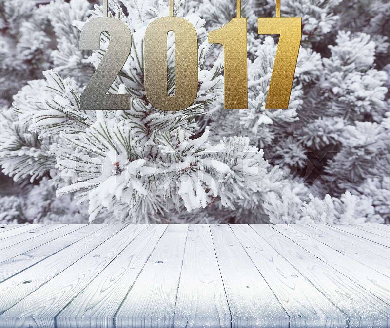 Wood table top on winter background, use for display of your products or content with word 2017, stock photo