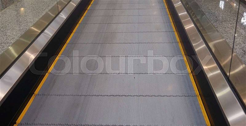 A moving walkway, flat escalator, stock photo