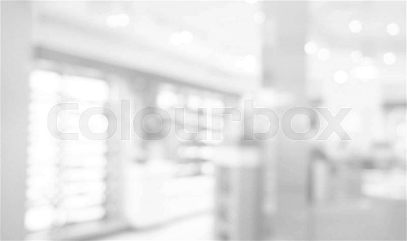 White grey bokeh blur of department store shopping background, stock photo