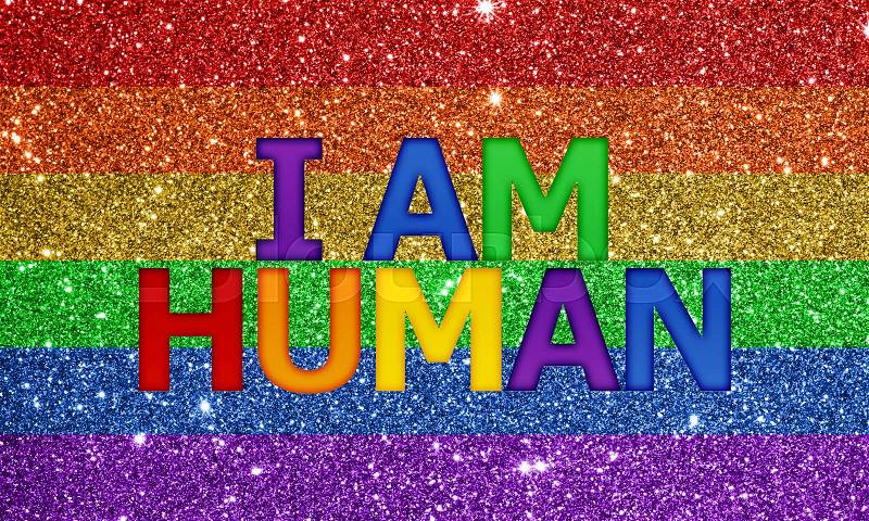 I am HUMAN word on colorful glitter background, stock photo