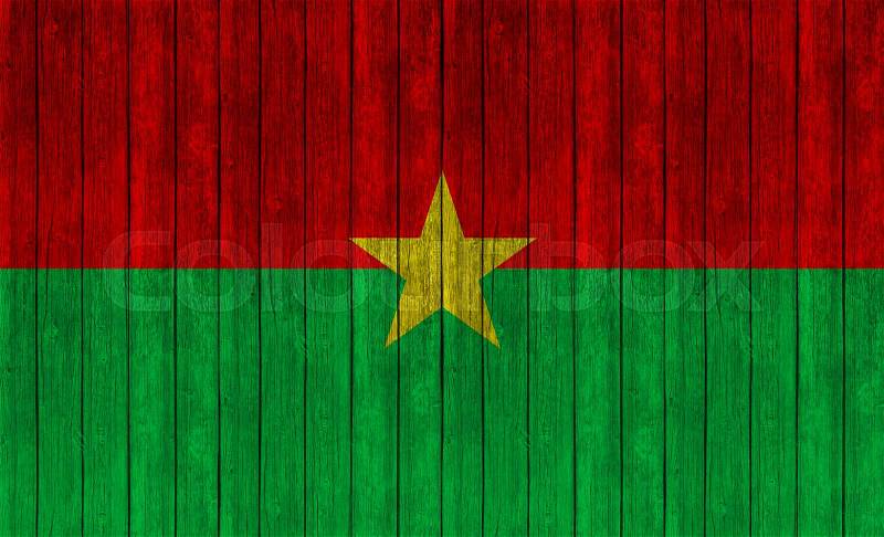 Burkina Faso flag on wood texture background, stock photo