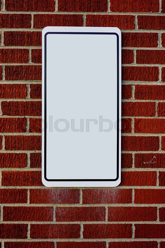 Red brick wall with blank sign, stock photo