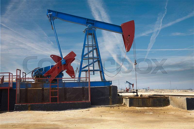Oil derrick - oil production in Azerbaijan. Drilling area near Baku, stock photo