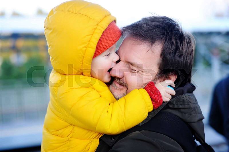 Middle age father with his little son having fun together outdoors. Happy fatherhood concept, stock photo