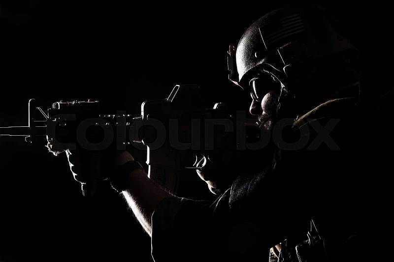 United states Marine Corps special operations command Marsoc raider. Contour backlit studio shot of Marine Special Operator black background, stock photo