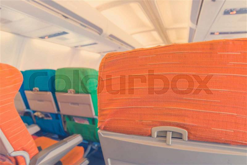 Airplane seat with in cabin of huge aircraft, stock photo