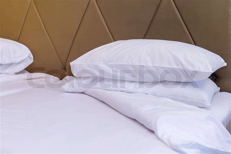 Bedroom with bed and pillow for relaxation, stock photo