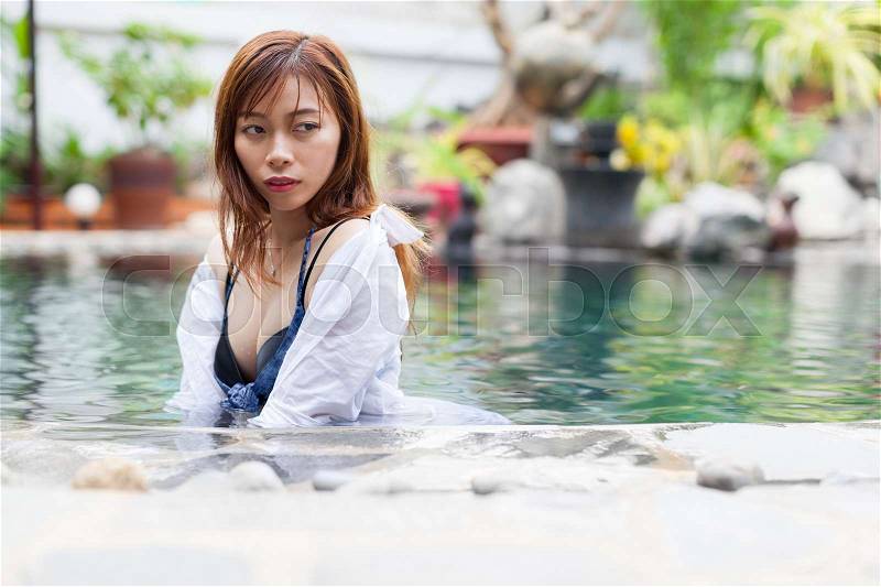 Beautiful Woman Swimming Pool At Resort Relaxed Portrait Young Asian Girl Tropical Vacation, stock photo
