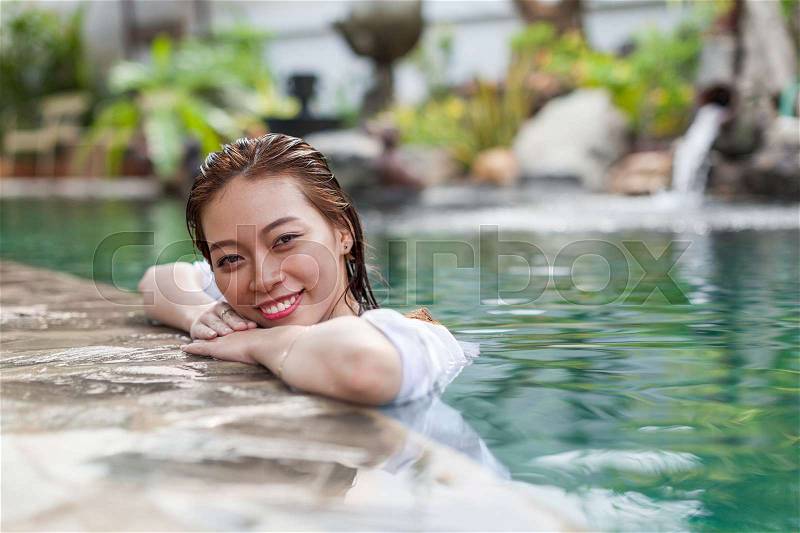 Beautiful Woman Swimming Pool At Resort Relaxed Portrait Young Asian Girl Happy Smile Tropical Vacation, stock photo