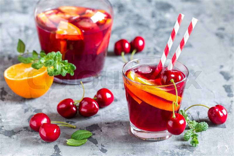 Summer cool alcoholic drink sangria with fresh fruits and berries, stock photo