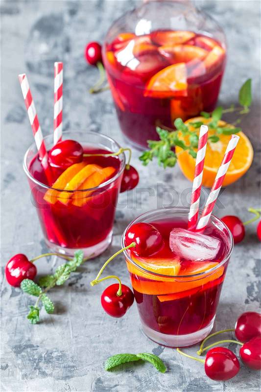 Summer cool alcoholic drink sangria with fresh fruits and berries, stock photo