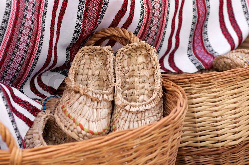 Braided Slippers in a basket at the fair masters in Ukraine, stock photo