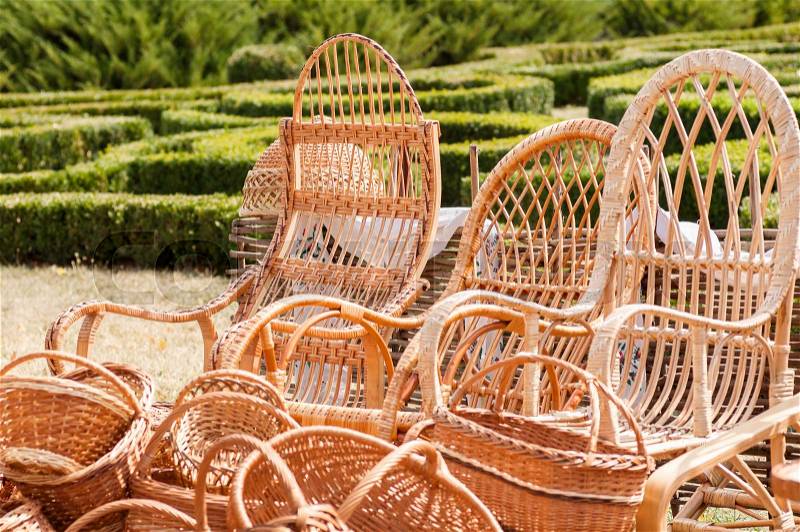 Wicker baskets and rattan armchairs at the fair masters in Ukraine, stock photo