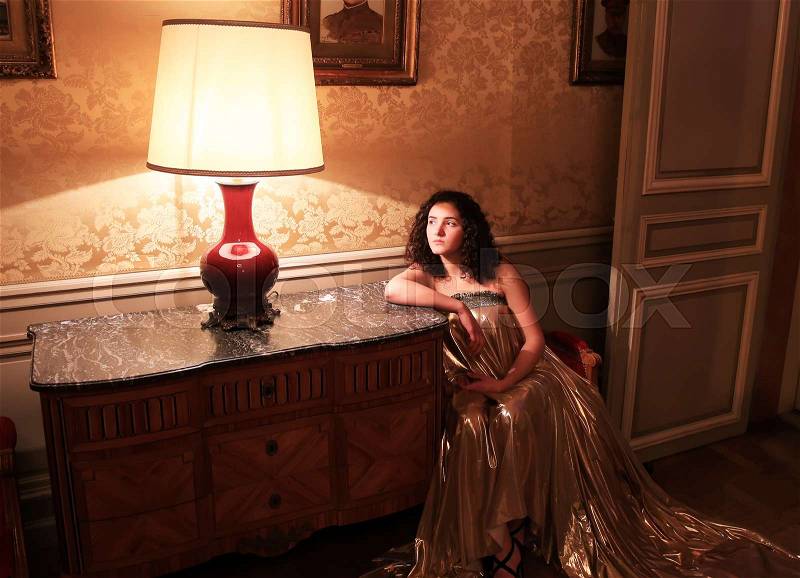 Beautiful lady in the vintage interior, stock photo