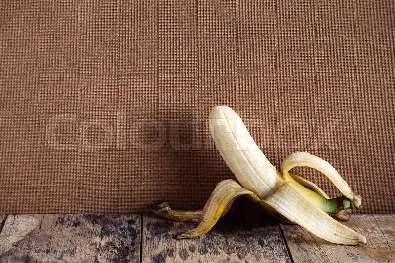 Banana peel on the old wooden floors and dirty, stock photo